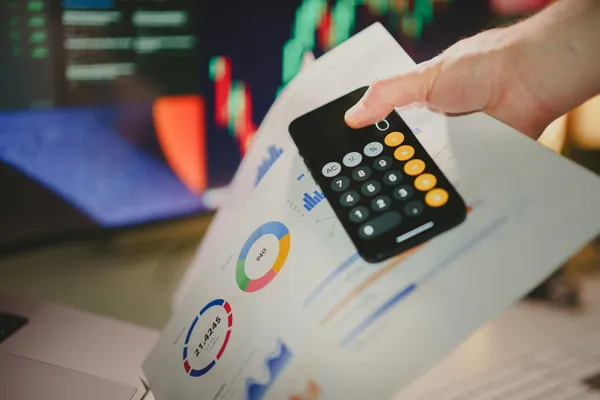 Calculator and paperwork on a desk